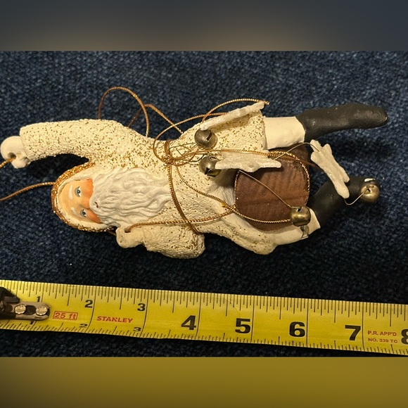 Wild western Santa hangs from gold thread with stars and bells. - Picture 6 of 8